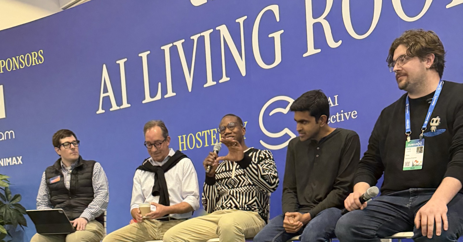Tyrone Ross gesturing on the AI Living Room panel at Human X